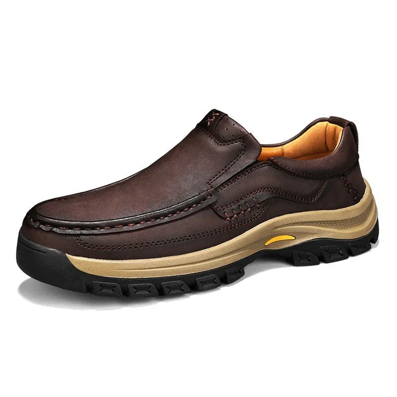 Men's black leather mountaineering shoes with thick rubber soles and round toe.
