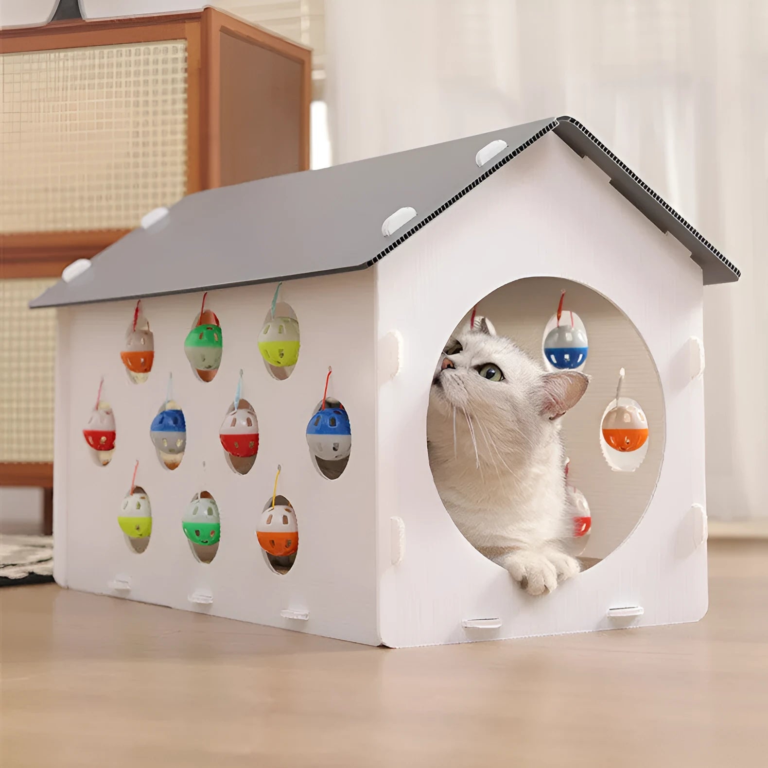 Plastic cat scratch board integrated with nest area, tunnel and bell ball toy components