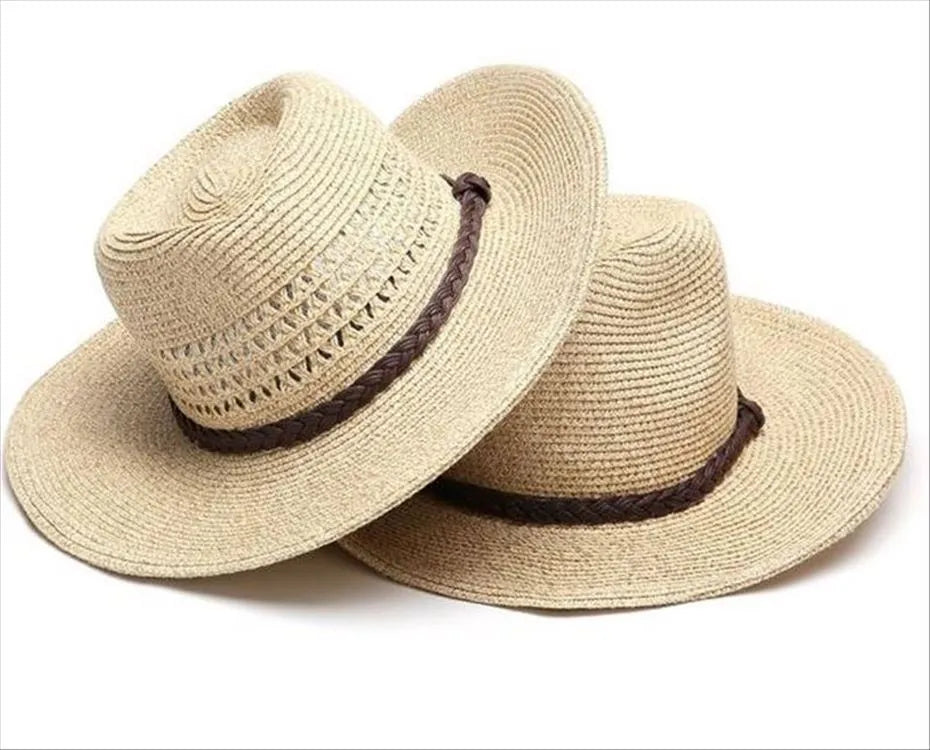 Men's foldable straw sun hat with big brim in beige colour on outdoor background