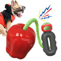 Plastic apple-shaped dog toy with food-dispensing hole and squeaker in green colour