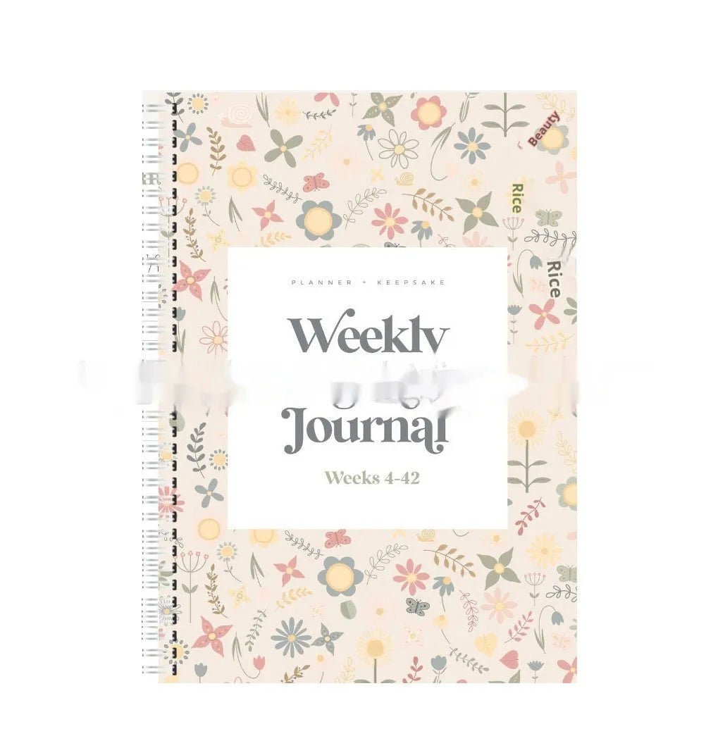 A5 pregnancy weekly diary notebook open showing weekly format pages