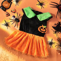 Small dog wearing a Crystal Velvet Halloween pumpkin skirt costume.