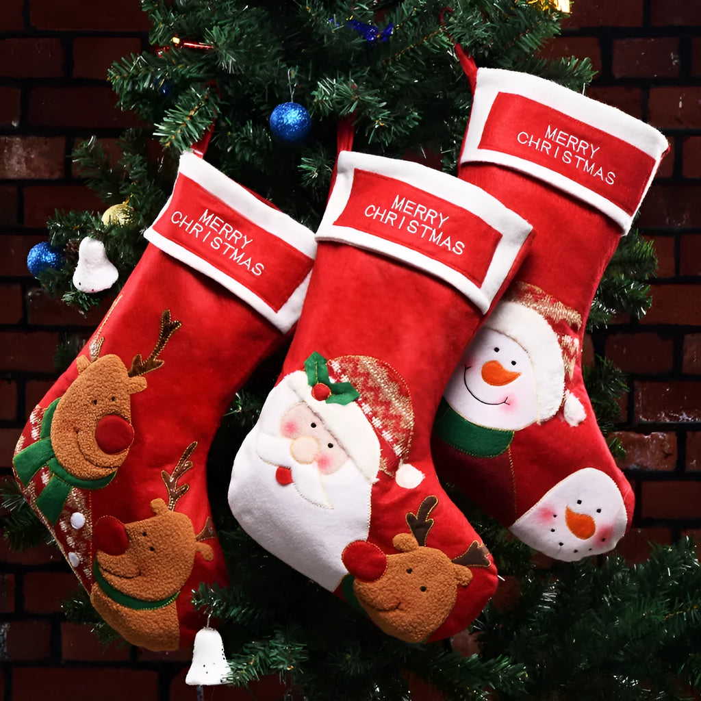 Set of three Christmas stocking ornaments with snowman, elk, and elderly figure designs