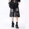 Men's loose fit distressed denim shorts with ripped knee detailing in retro style