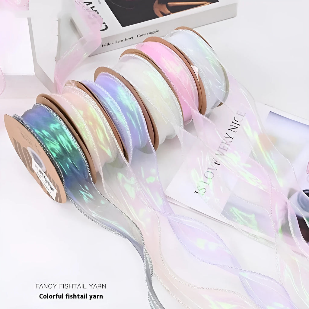 Roll of 4cm wide mesh fishtail yarn craft ribbon in various illusion colours.