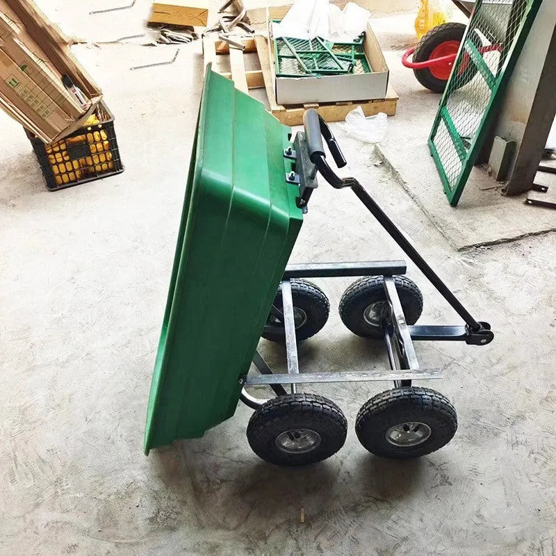Green four-wheel steel and plastic dumptruck with a large hauling bed.