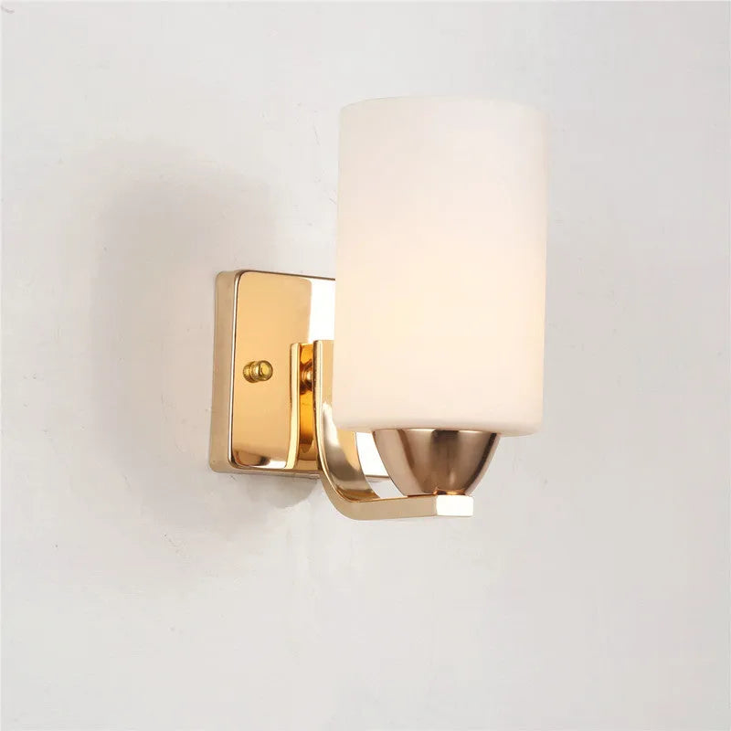 Minimalist chrome wall lamp with a glass shade shown in single head and double head configurations