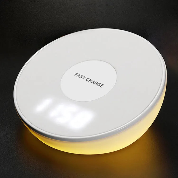 White QI wireless phone charger with digital clock display and three control buttons.