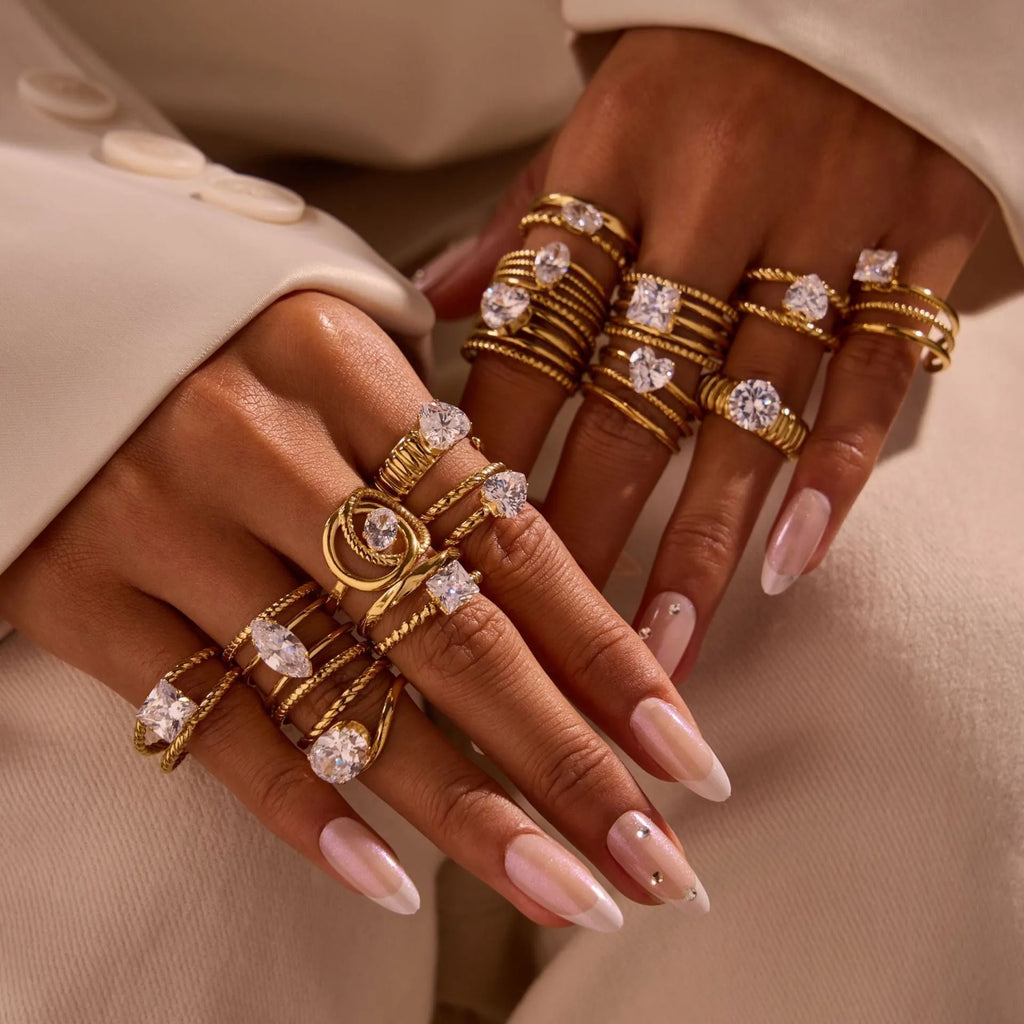 Gold electroplated stainless steel ring with zircon detailing and open mouth adjustable design