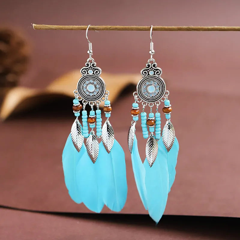 Round drop feather earrings with leaf design in alloy, showing electroplated finish in one of thirteen available colours.