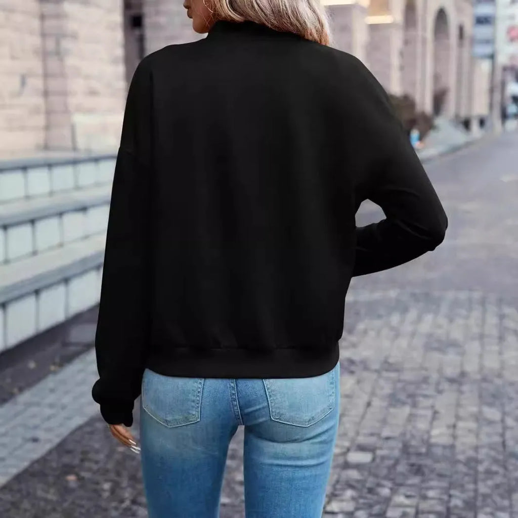 Black women's casual zip-up jacket with long sleeves and faux pockets on the front.
