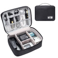 Black waterproof electronics organiser bag open to show removable dividers and mesh pockets for cables.