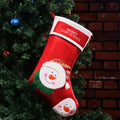 Set of three Christmas stocking ornaments with snowman, elk, and elderly figure designs