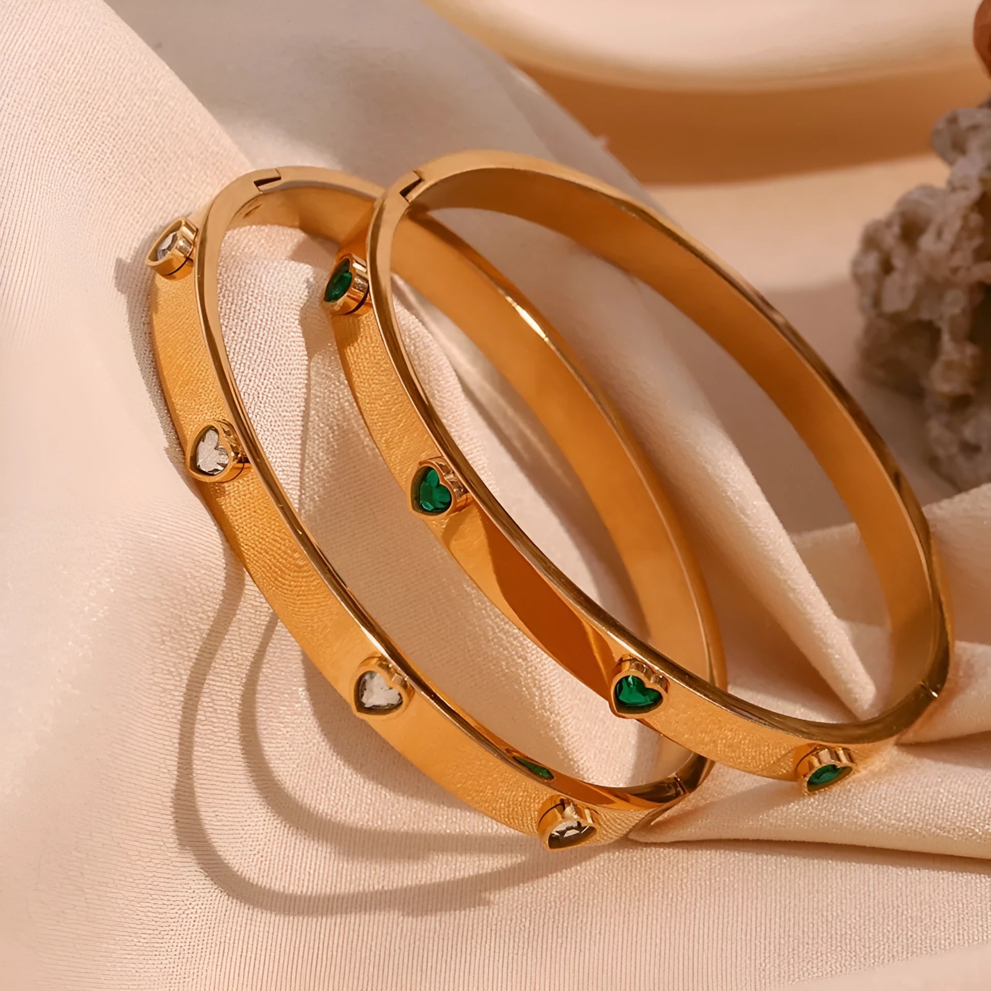 Gold stainless steel women's bracelet with a small micro-inlaid peach heart, shown with green and white diamond accent options.