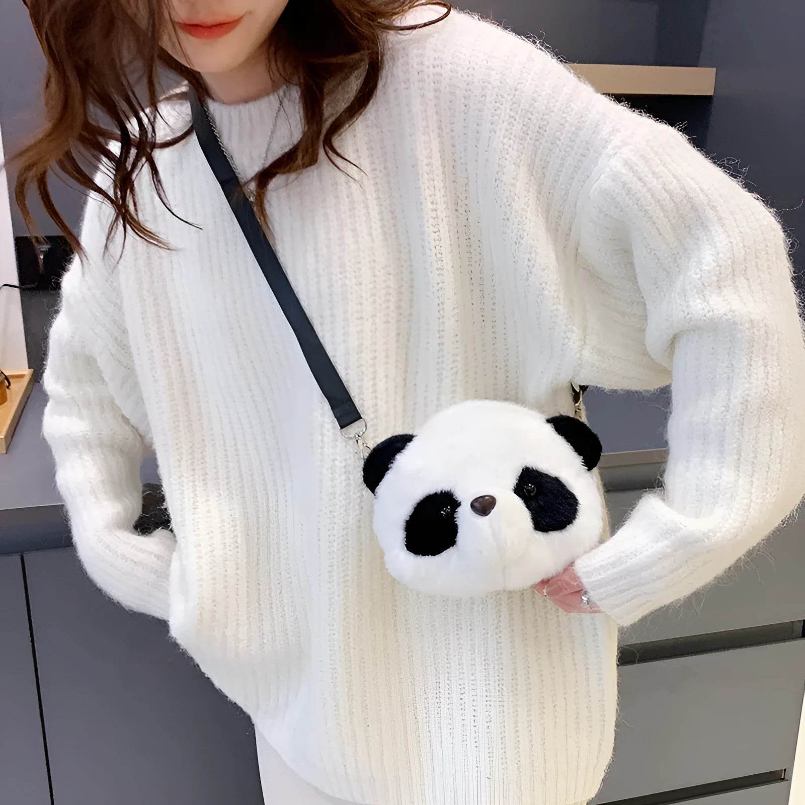Soft plush panda head design crossbody bag shown in cylindrical shape.