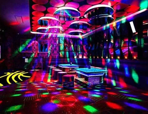 LED laser magic fan stage lighting equipment with dual projection effects in black housing