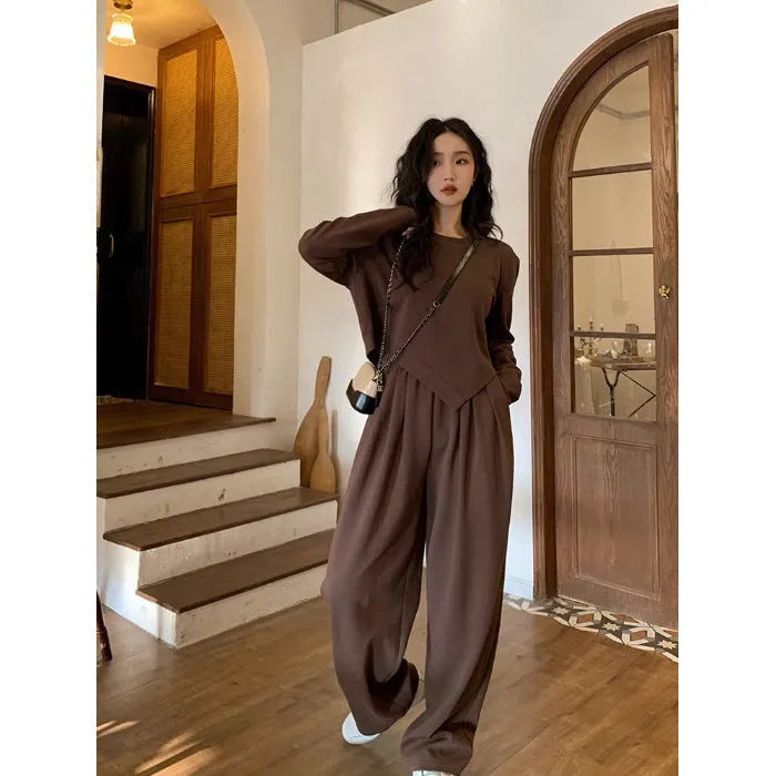 Women's khaki loose-fit casual sportswear set with long sleeve top and trousers on a hanger.