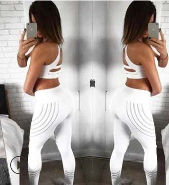 Women's reflective workout leggings with glow print in black and white colours showing slim-fit pencil pants design