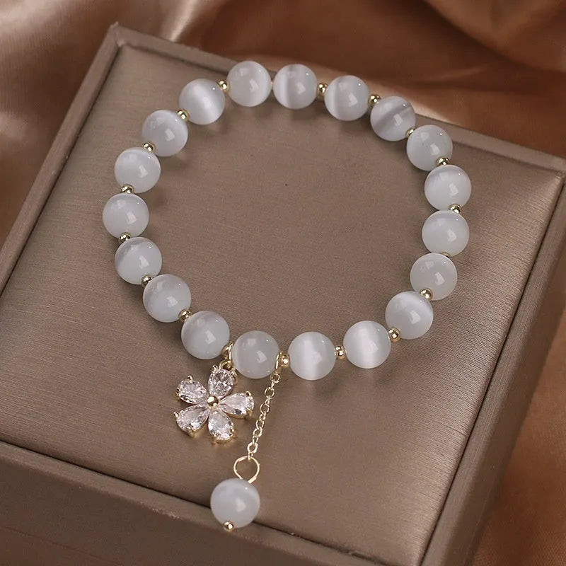 White cat's eye crystal bracelet with flower tassels and morganite safety buckle pendant