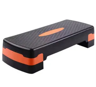 Grey Fit Step aerobics platform on a wooden floor for home fitness workouts.