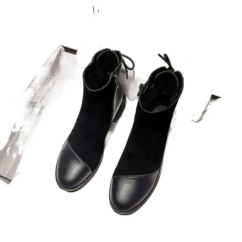 Women's black Martin boots with side zipper, round toe, and knee-length design
