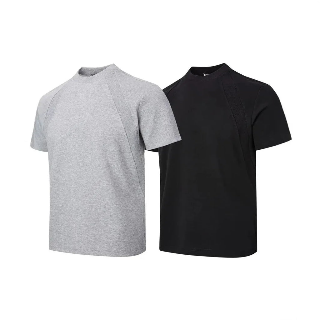 Man wearing a loose fit grey short sleeve top with visible air layer stitching texture.