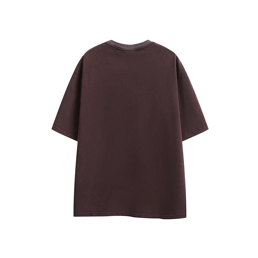 A loose-fit washed cotton short-sleeve retro T-shirt shown in purple and black colour options.