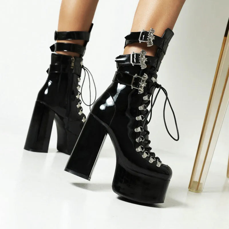 Chunky high-heel platform thigh-high boots in black patent leather with front lacing and block heel