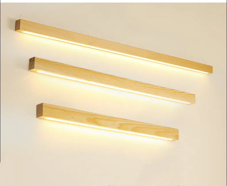 Walnut colour linear wood and acrylic wall lamp in three lengths with minimalist square profile