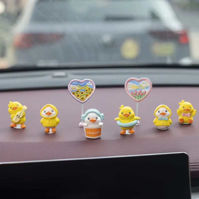 Cartoon duckling car decoration set with six PVC ducks and rectangular dashboard sign