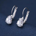 Drop-shaped women's fashion earrings in gold or platinum finish with an inlaid gem
