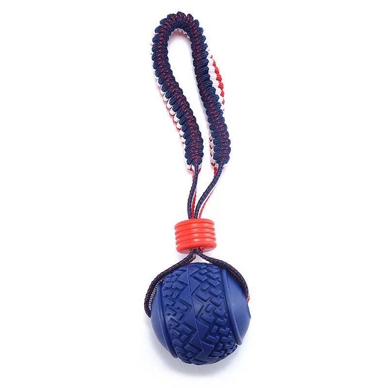 Blue dog ball with attached rope toy for small medium dogs showing textured surface