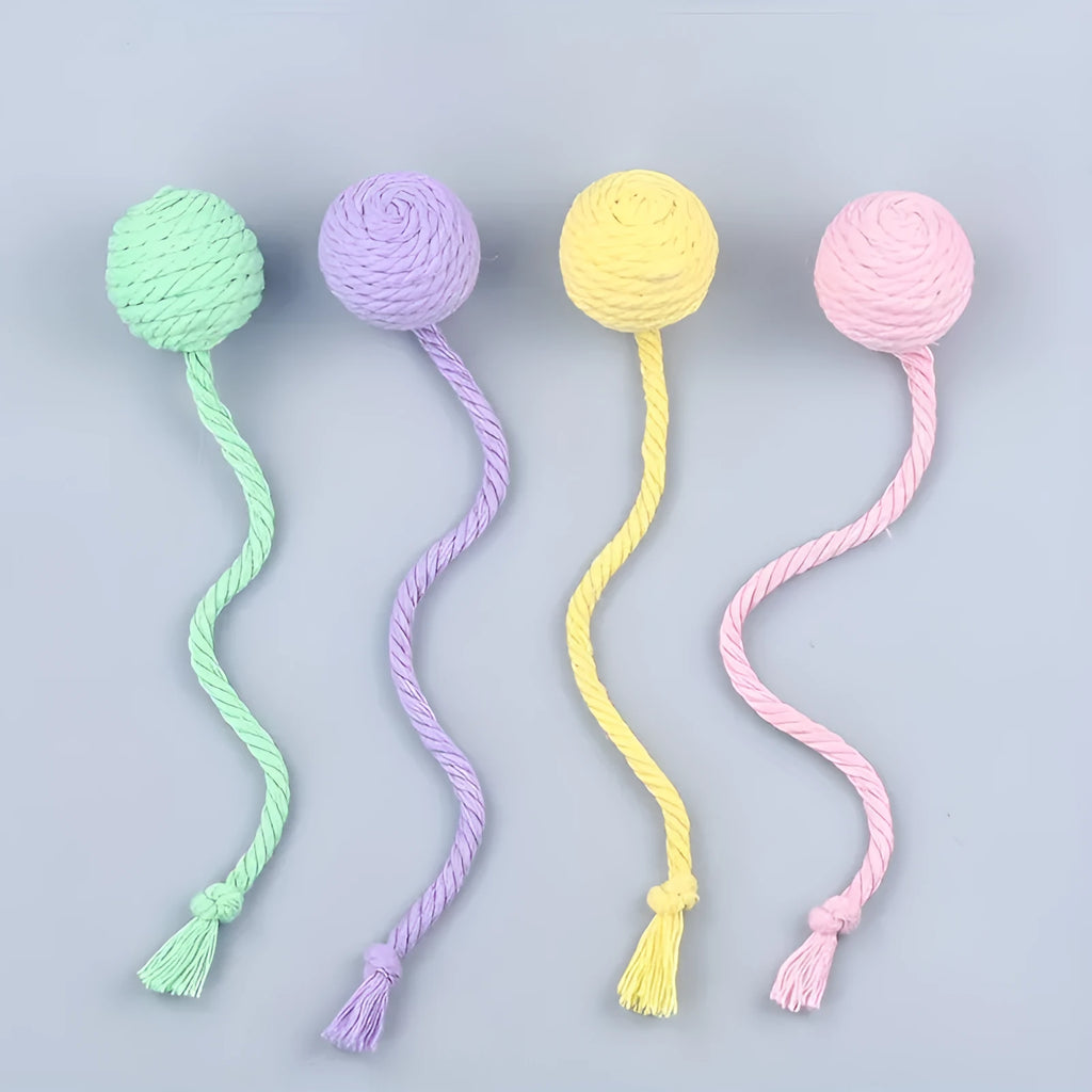 Cat toy ball with rope and bell inside in green, pink, purple, and yellow colours
