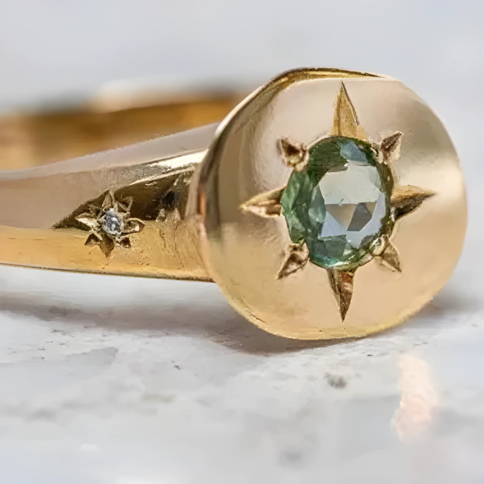 Gold-coloured adjustable ring featuring an oval star shape with a zircon stone.