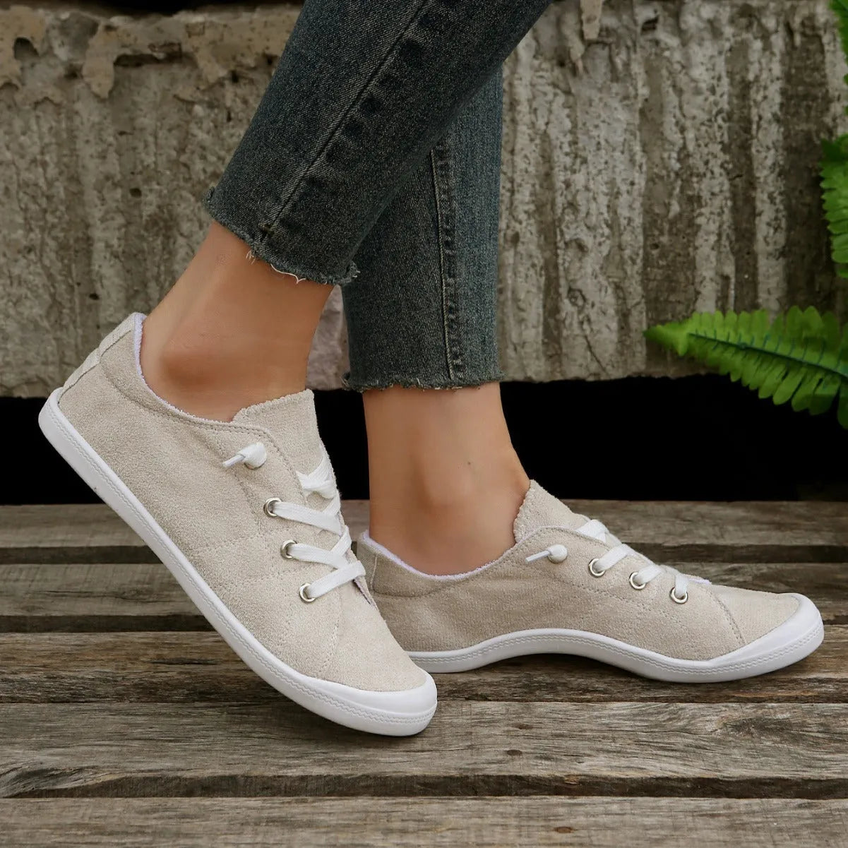 Women's creamy white fabric casual sneakers with rubber sole low top design