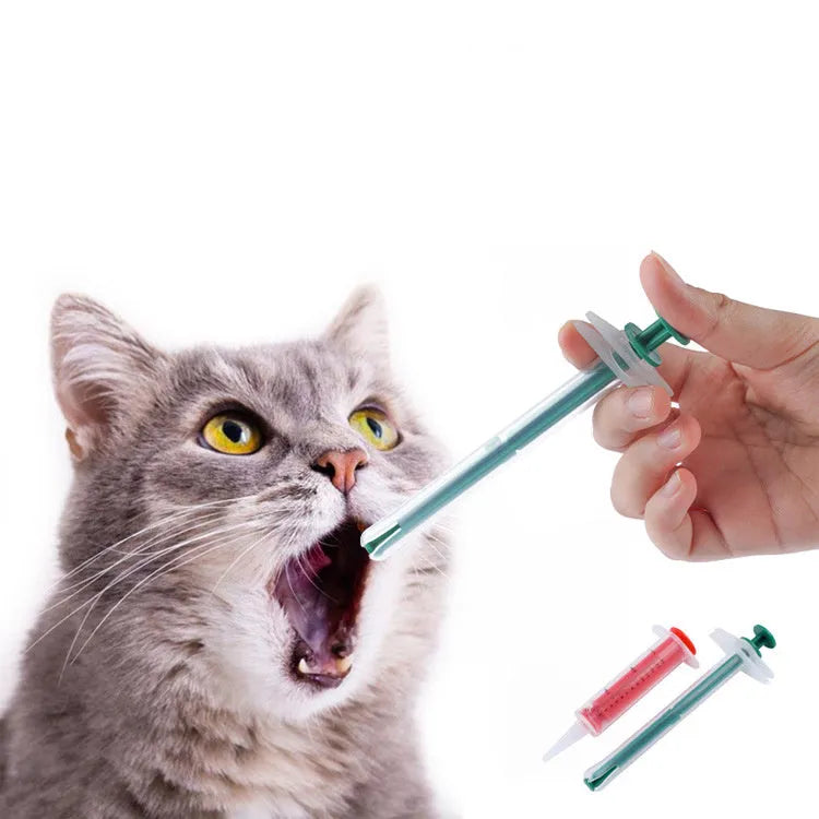 Two pet pill shooter syringes with soft silicone tips for administering medication to cats and dogs