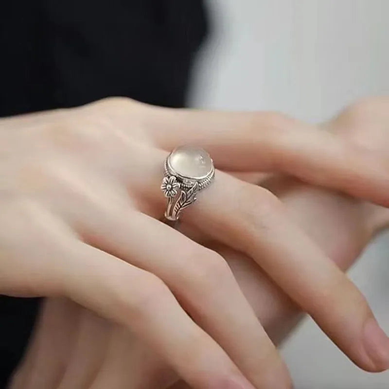 Adjustable open-mouth vintage ring in antiqued copper with a white chalcedony-style colour.