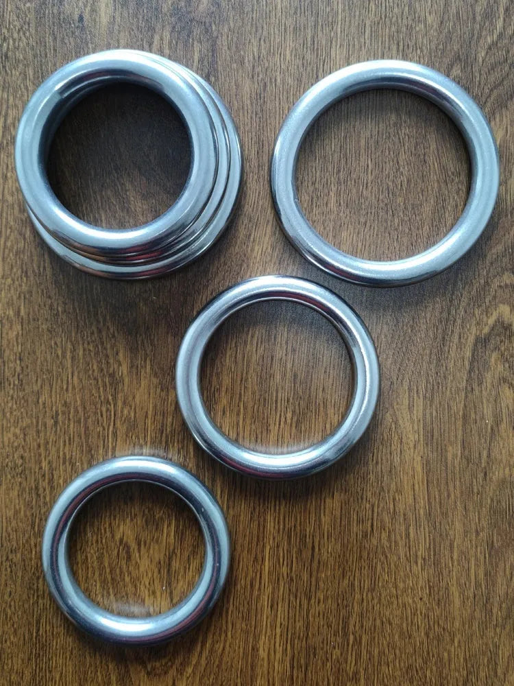 Carbon steel Wing Chun training ring for Iron Arm Skill on a plain background, showing three size options.