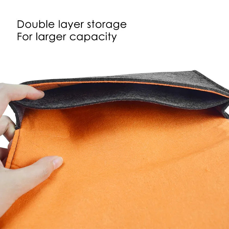 Black felt Nintendo Switch carrying case showing game card slots and storage compartments