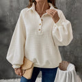 Women's milky white polo collar textured sweater on a hanger