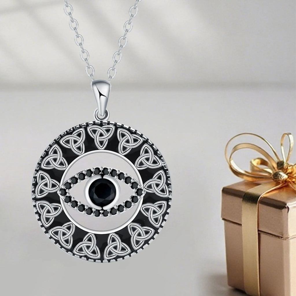 Blue Devil's Eye pendant on a copper cross chain necklace for women.