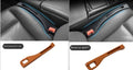 Black plastic car seat gap storage organiser box with a handle.