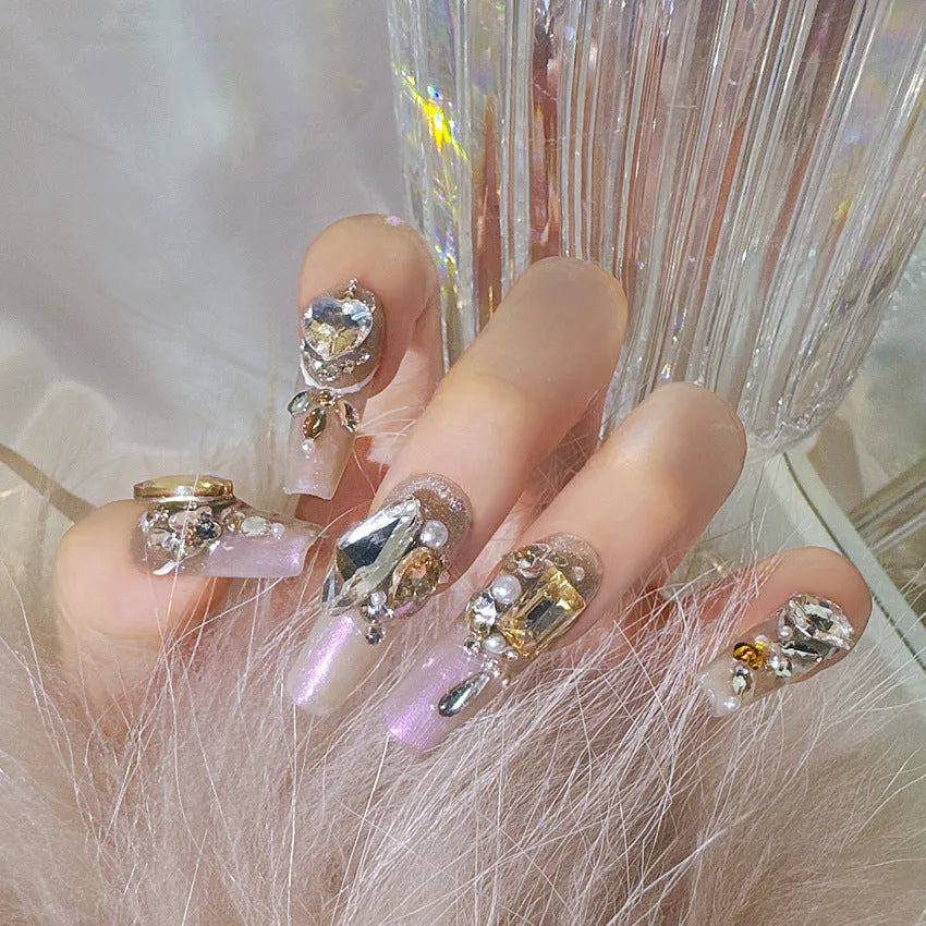 Rhinestone decorated false nail patches on a card, with jelly adhesive or tool set options.