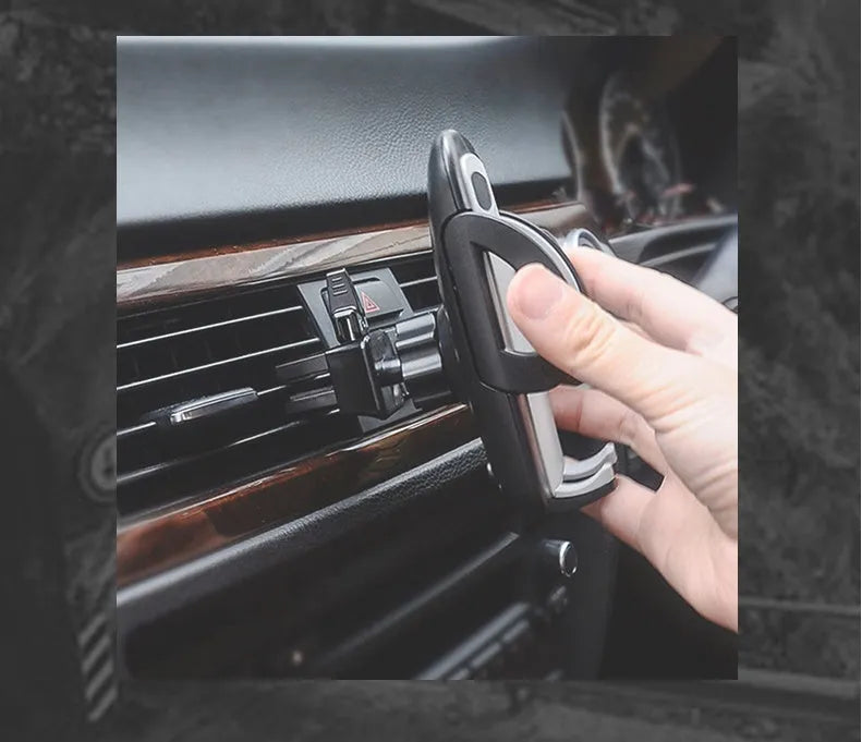 Black plastic car air conditioning vent mobile phone holder mounted on vehicle dashboard