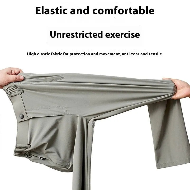 Man wearing black loose-fit straight-leg Ice Silk trousers with an elastic waistband for leisure wear.