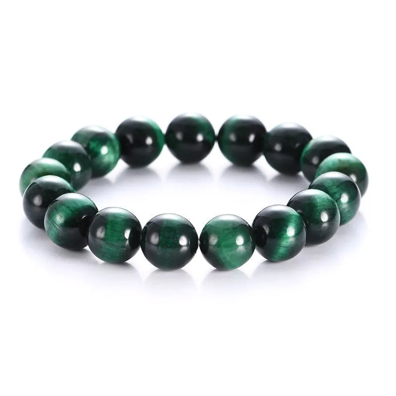 Polished green tiger eye stone bracelet with geometric beads on a wrist, showing size options.