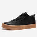 Men's black leather casual shoes with round toe, flat heel, and lace-up closure on rubber sole