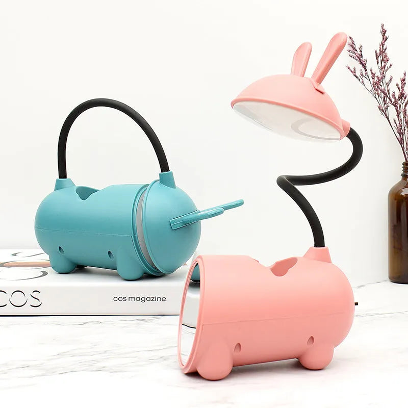 Green cartoon USB desktop lamp with pen storage container on wooden desk