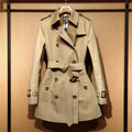 Khaki women's trench coat with double-breasted front and flight sleeves