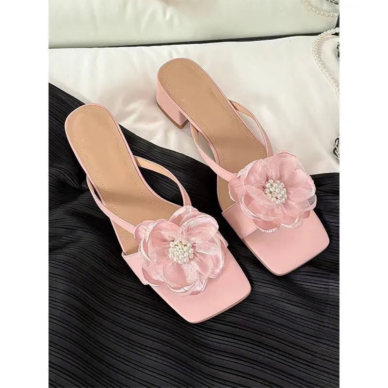 Beige women's sandals with a chunky heel, square toe, and a single satin strap across the foot.